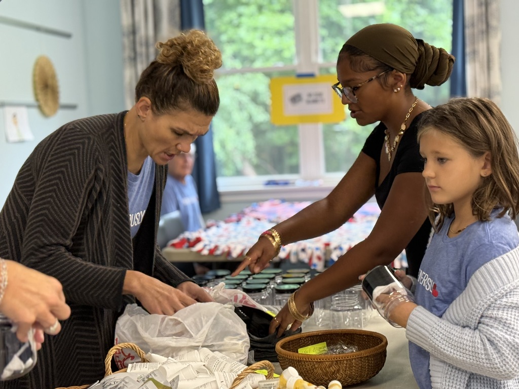 Volunteers of different generations preparing meals together